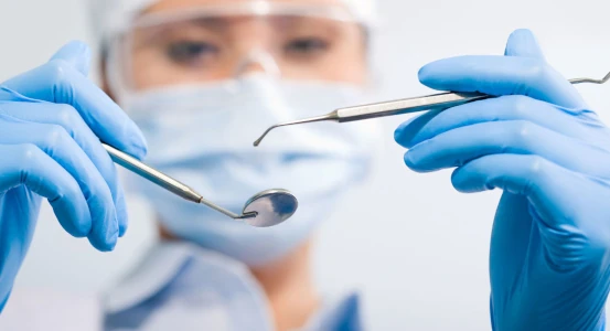 photo of a dental instrument in the hands of a dentist at the Bagita Clinic