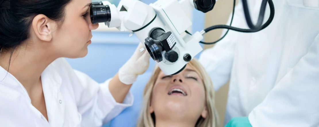 Dental treatment with a microscope