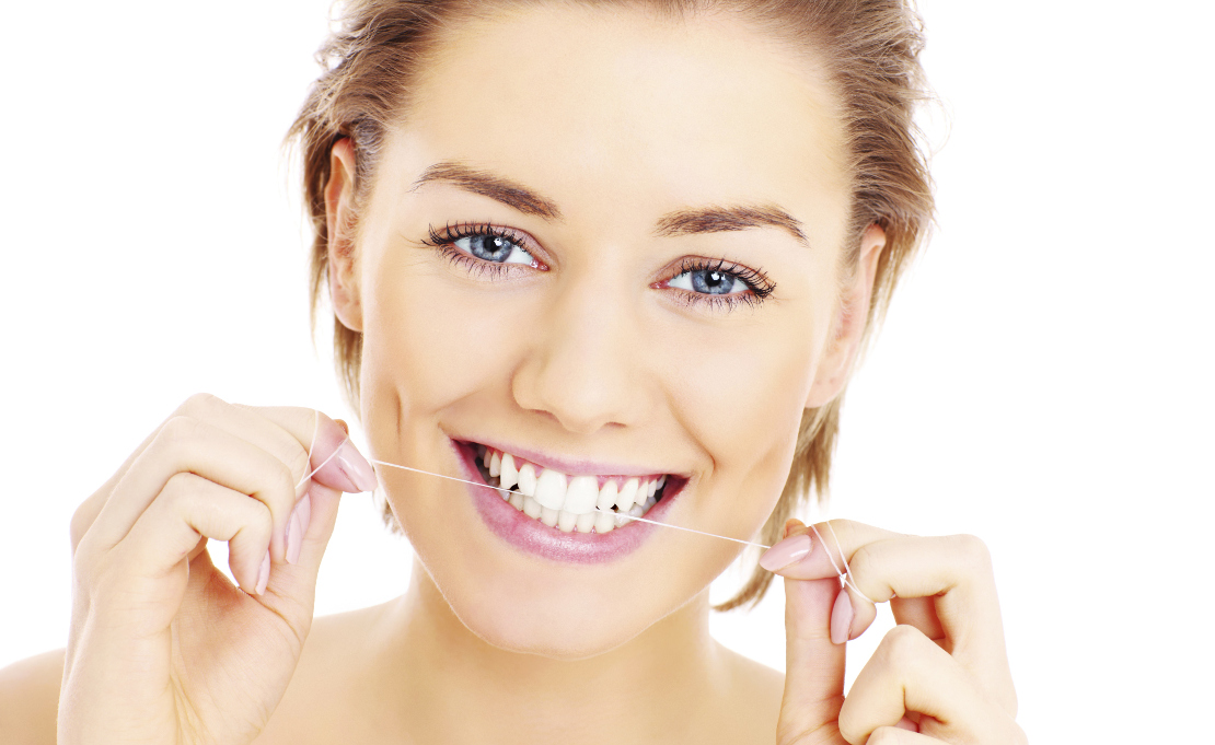 photo of a girl with dental floss for dental hygiene after a filling at Bagita Clinic in Cherkassy